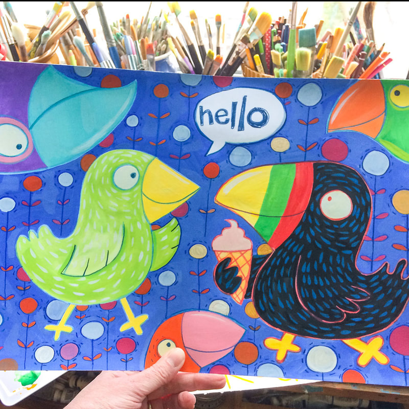 a painting of birds in a children's book style being held against a backdrop of artists materials