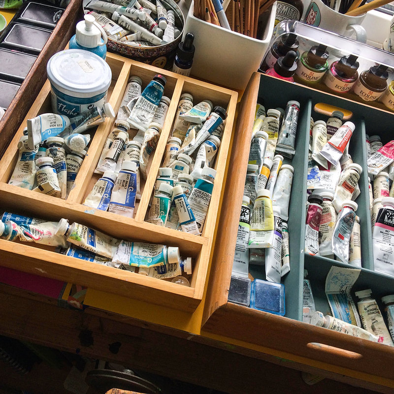 photograph of Jo Brown's wooden trays full of artists materials 